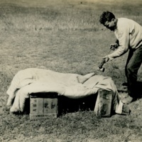 Camp Logan spraying bedding.jpg